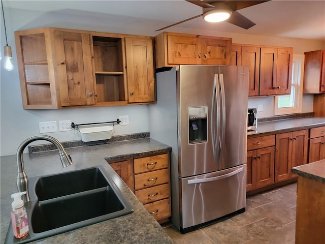 kitchen with sink, hanging light fixtures, and stainless steel appliances