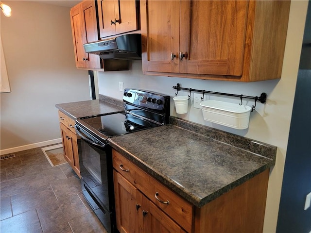 kitchen with black range with electric cooktop and extractor fan