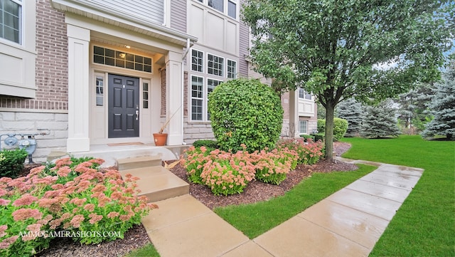 entrance to property with a yard