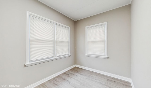 spare room with light wood-type flooring