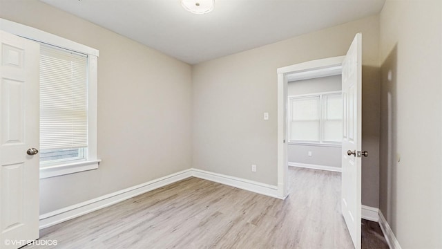 spare room featuring light wood-type flooring