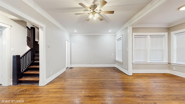 empty room featuring crown molding, hardwood / wood-style floors, and ceiling fan