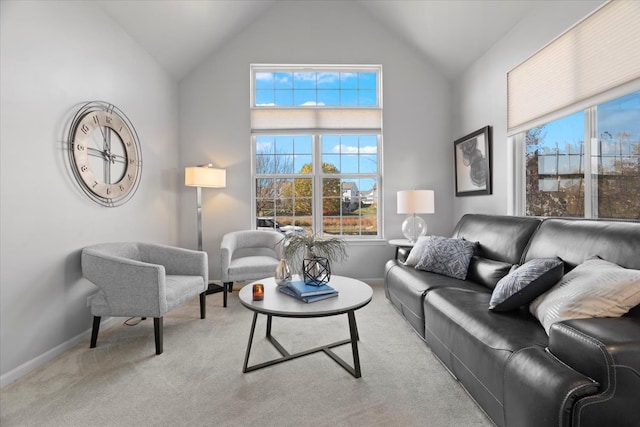 living room with light carpet and vaulted ceiling