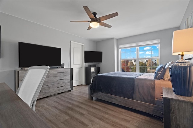 bedroom featuring hardwood / wood-style floors and ceiling fan