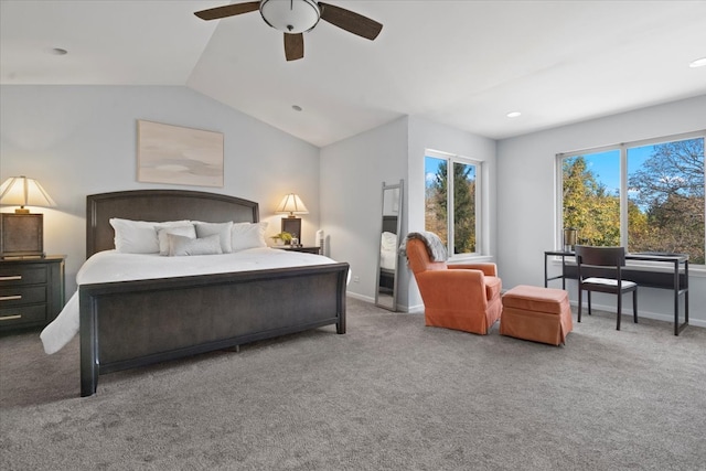 bedroom featuring ceiling fan, light colored carpet, and vaulted ceiling