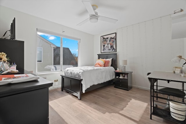 bedroom with ceiling fan and light hardwood / wood-style flooring