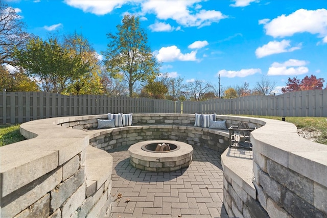 view of patio / terrace featuring a fire pit