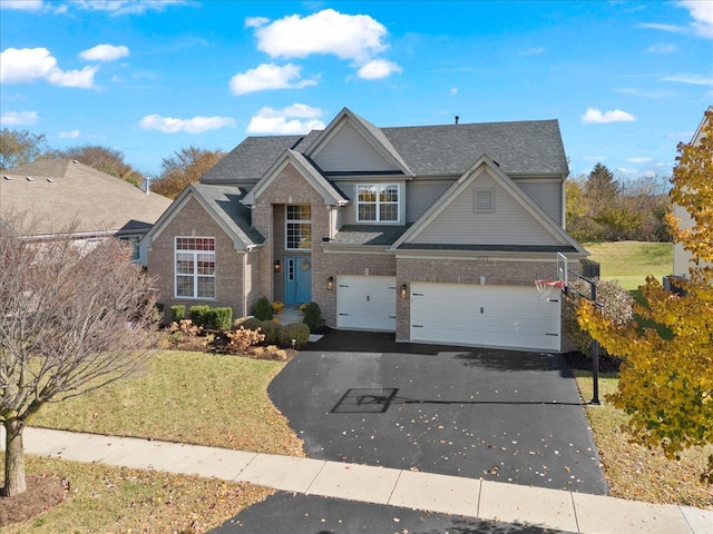 view of front facade with a front yard and a garage