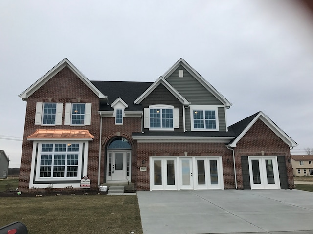 view of front of house featuring french doors and a front yard