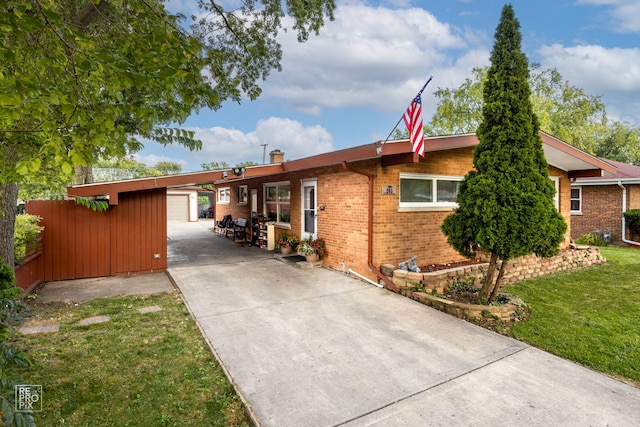 view of home's exterior featuring an outbuilding, a garage, and a lawn