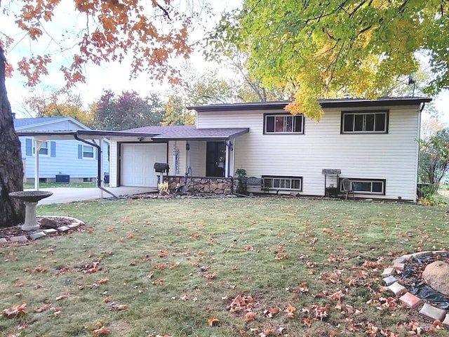 view of front of house featuring a garage and a front yard