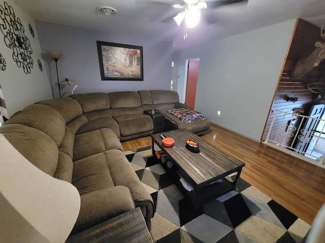 living room with hardwood / wood-style floors and ceiling fan