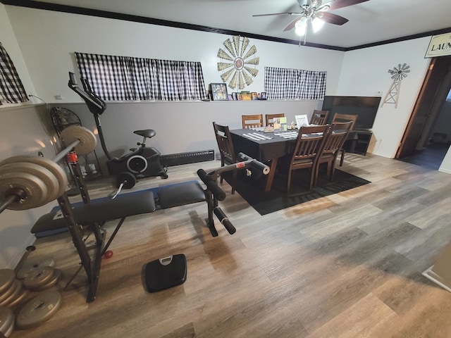 dining space featuring ornamental molding, hardwood / wood-style floors, and ceiling fan