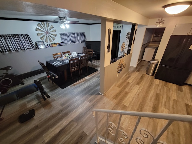 interior space with hardwood / wood-style flooring and ceiling fan