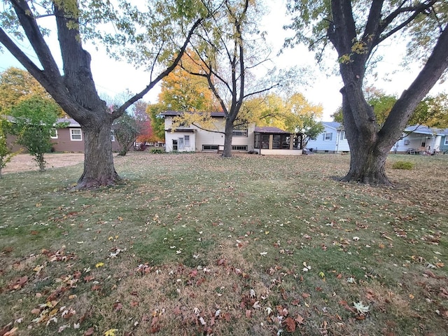 view of yard with a sunroom