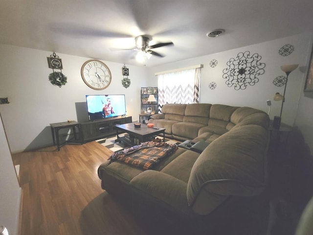 living room featuring hardwood / wood-style flooring and ceiling fan