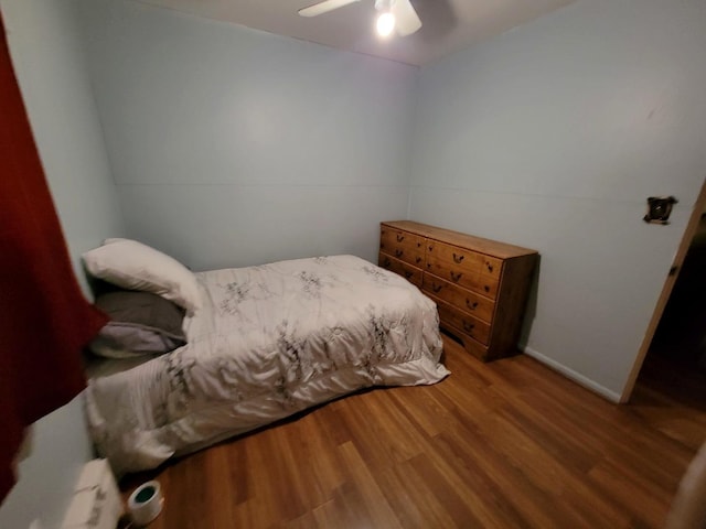 bedroom featuring hardwood / wood-style flooring and ceiling fan