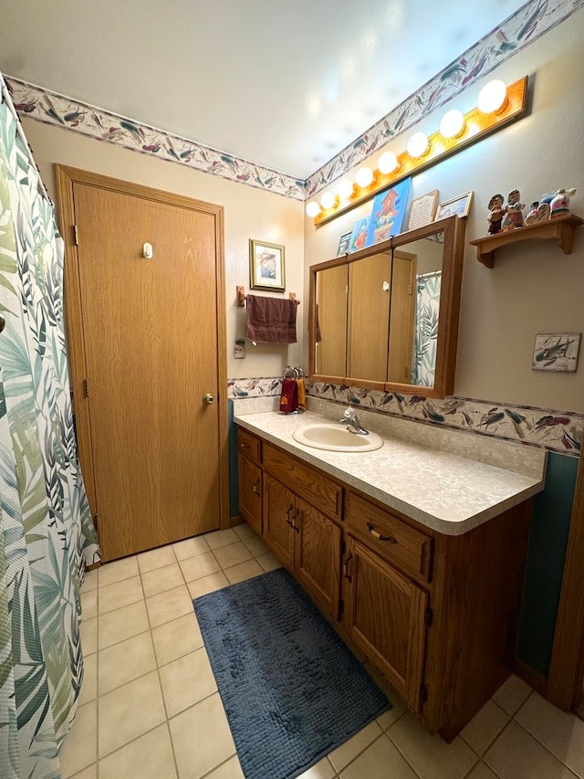 bathroom with tile patterned flooring and vanity