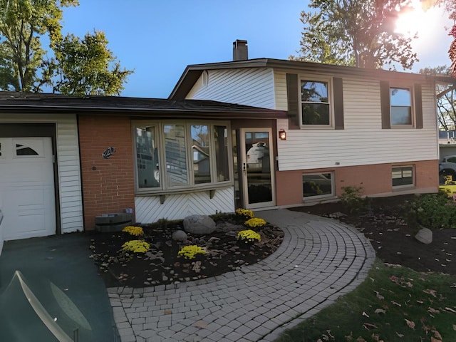 split level home with a garage