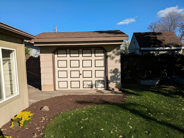 garage featuring a yard