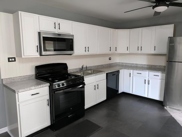 kitchen with white cabinetry, ceiling fan, black appliances, and sink