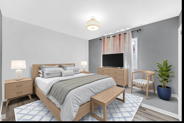 bedroom featuring dark hardwood / wood-style flooring