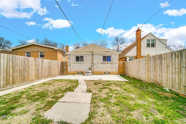 back of property with a patio area