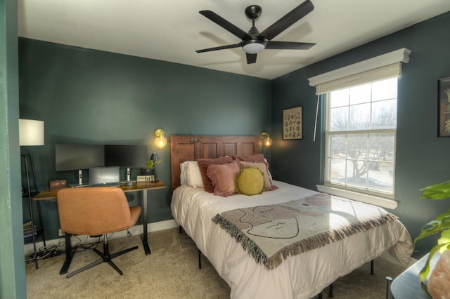 bedroom with ceiling fan and light carpet