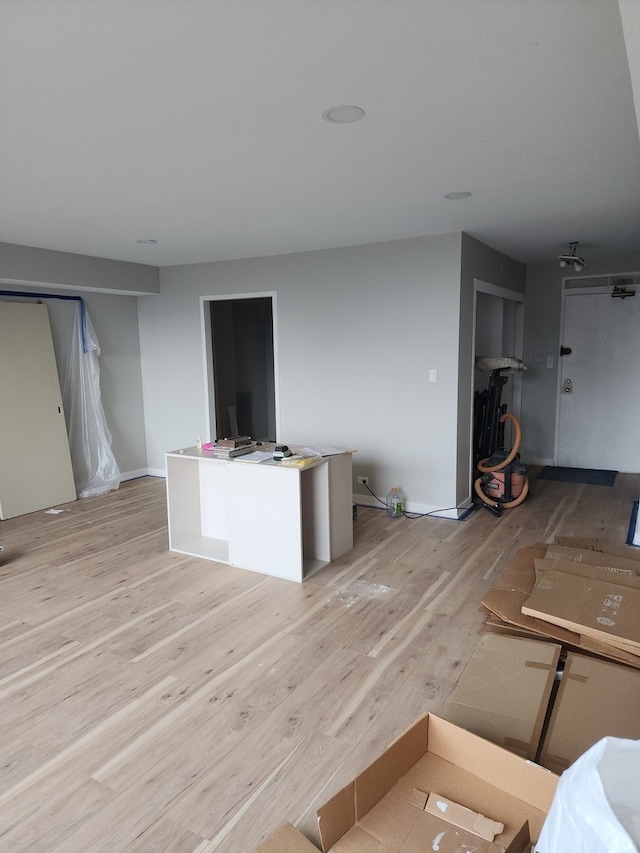 unfurnished living room featuring light wood-type flooring