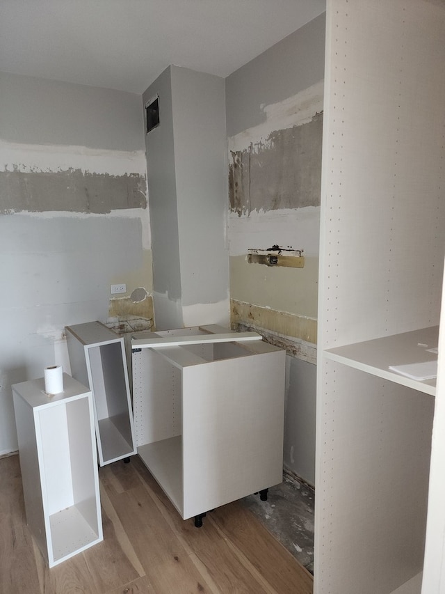 laundry area with light hardwood / wood-style flooring