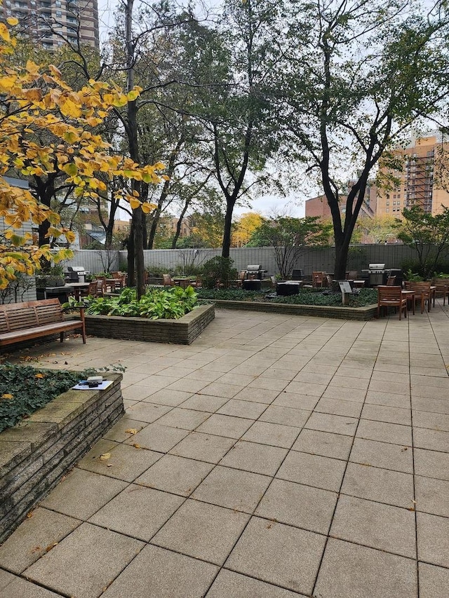 3600 N Lake Shore Dr Unit 622, Chicago, IL 60613 - surrounding community with a patio area, a fenced backyard, and outdoor dining space