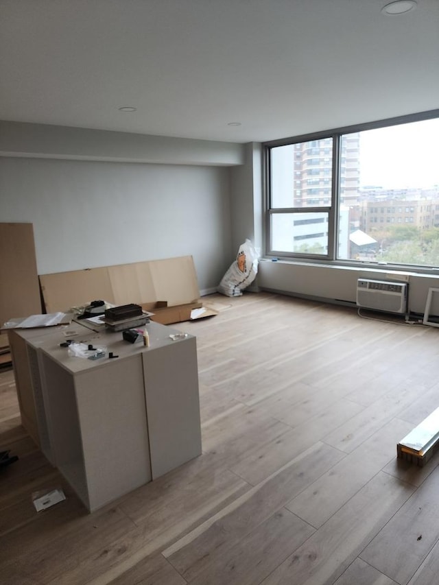 3600 N Lake Shore Dr Unit 622, Chicago, IL 60613 - living room featuring an AC wall unit and light wood finished floors