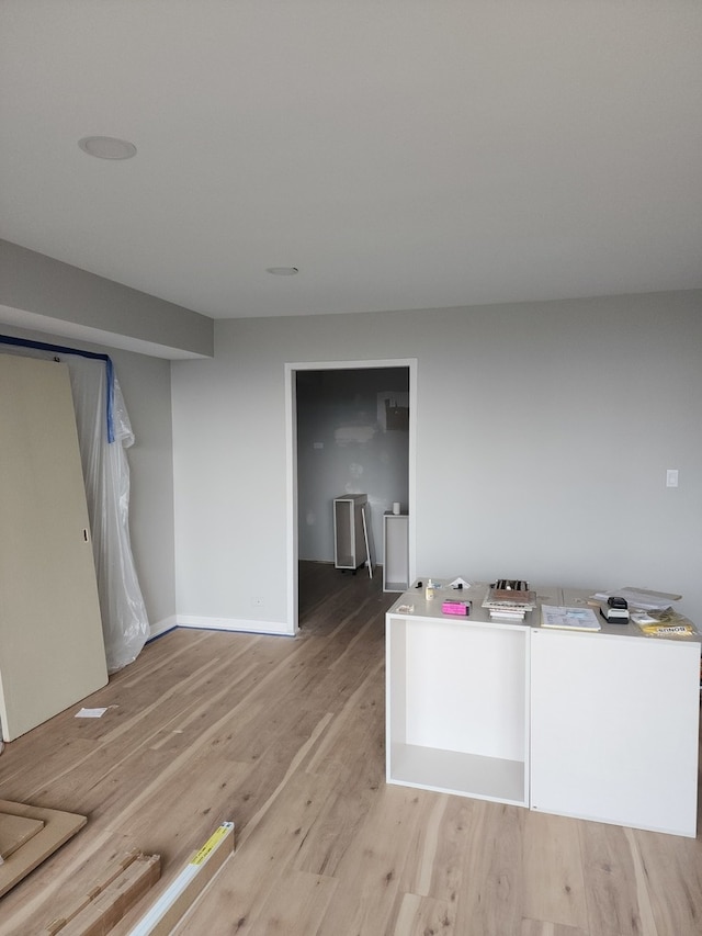 interior space featuring light wood-type flooring and independent washer and dryer