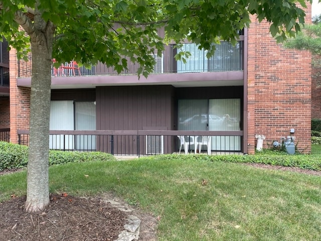 view of side of home featuring a lawn