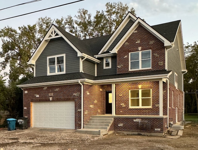 view of front of house with a garage and a porch