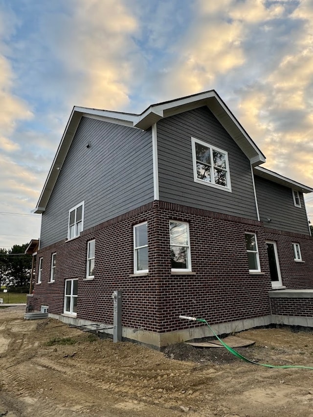 view of property exterior at dusk