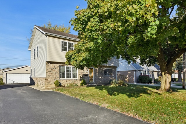 obstructed view of property featuring a garage and a front lawn