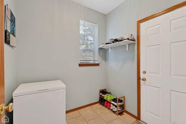 laundry area featuring light tile patterned flooring