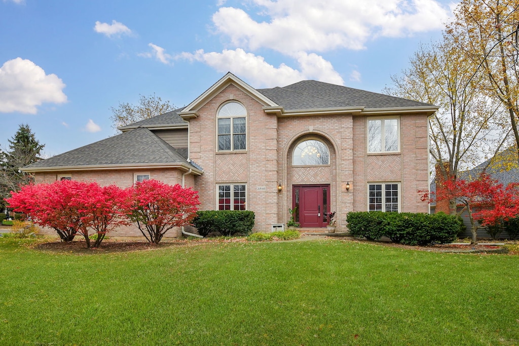 view of front property with a front lawn