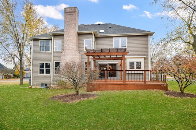 back of house featuring central air condition unit, a deck, a yard, and a pergola