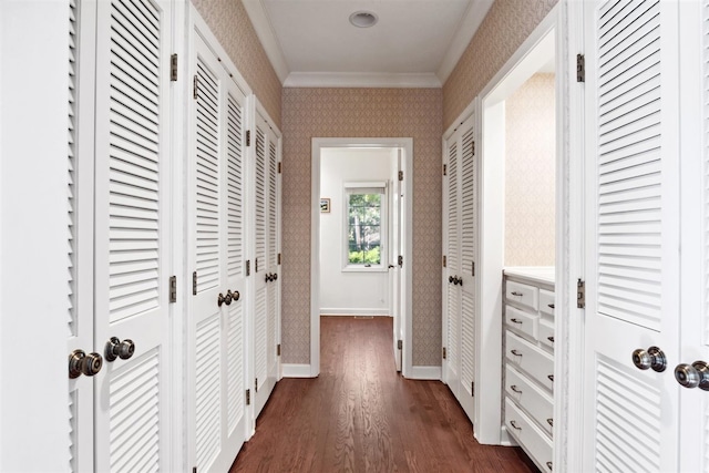 hall featuring crown molding and dark hardwood / wood-style floors