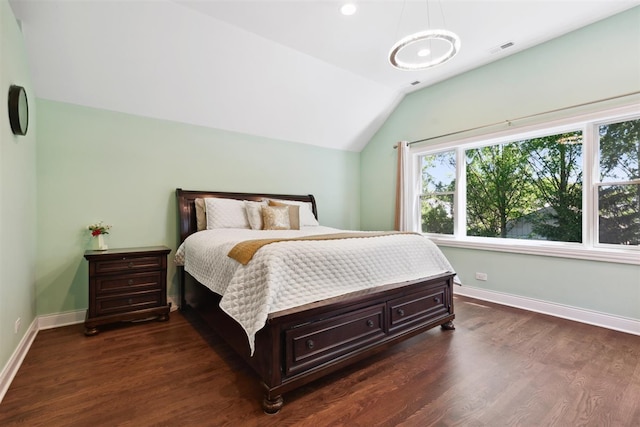 bedroom featuring lofted ceiling and dark hardwood / wood-style floors