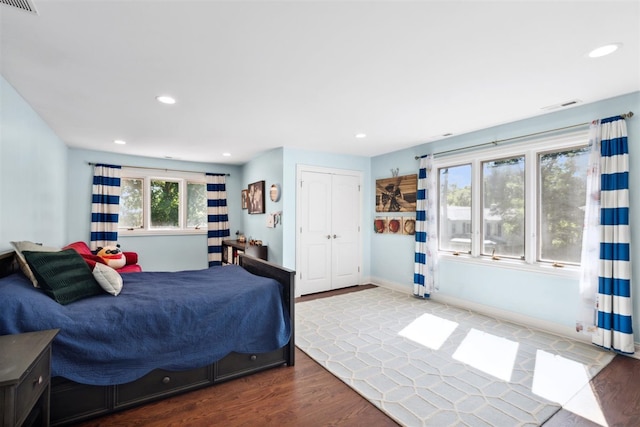 bedroom with a closet and wood-type flooring