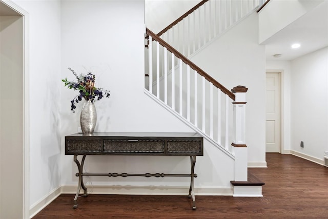 staircase with hardwood / wood-style flooring