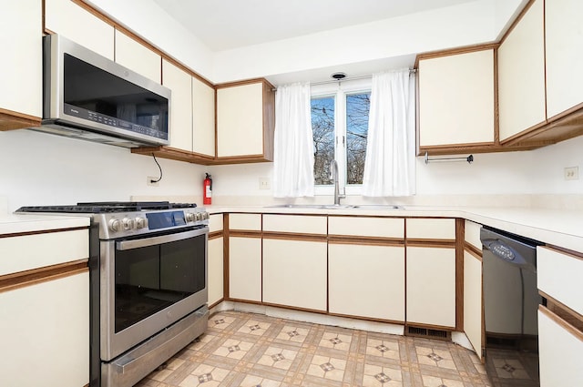 kitchen featuring white cabinets, sink, and stainless steel appliances