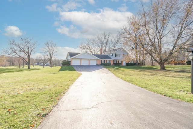 view of front of house featuring a front yard and a garage