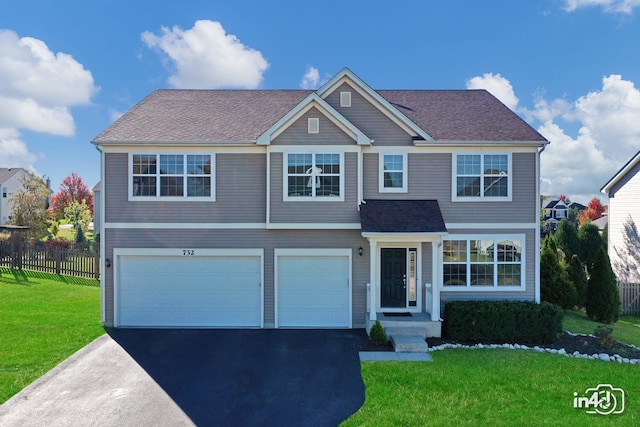 view of front facade featuring a front lawn and a garage