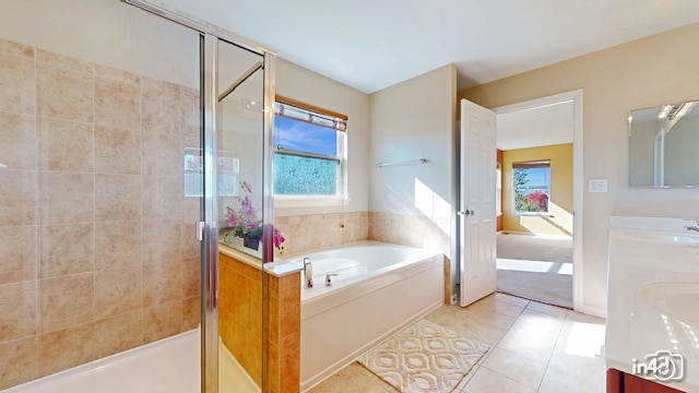 bathroom featuring vanity, tile patterned floors, and plus walk in shower