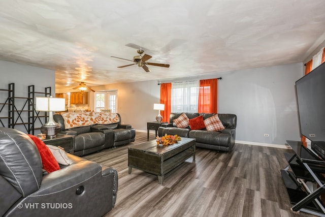 living room with ceiling fan and hardwood / wood-style floors