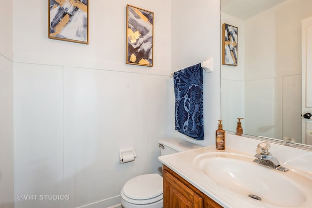 bathroom with vanity and toilet